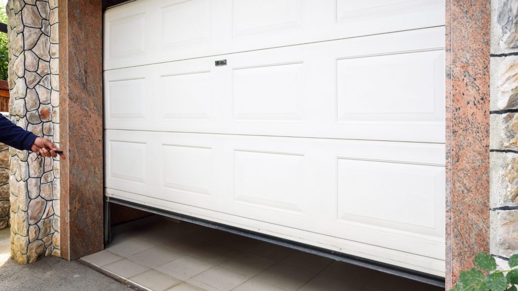 A garage door that moves slowly due to damaged garage door tracks