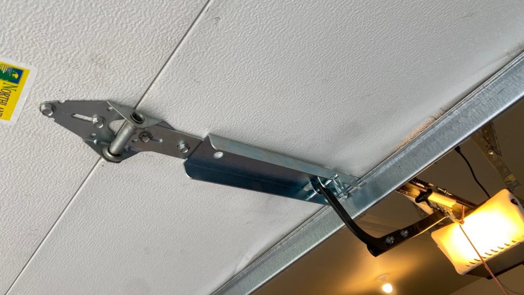A operator reinforcement bracket was replaced during the garage door hinge maintenance