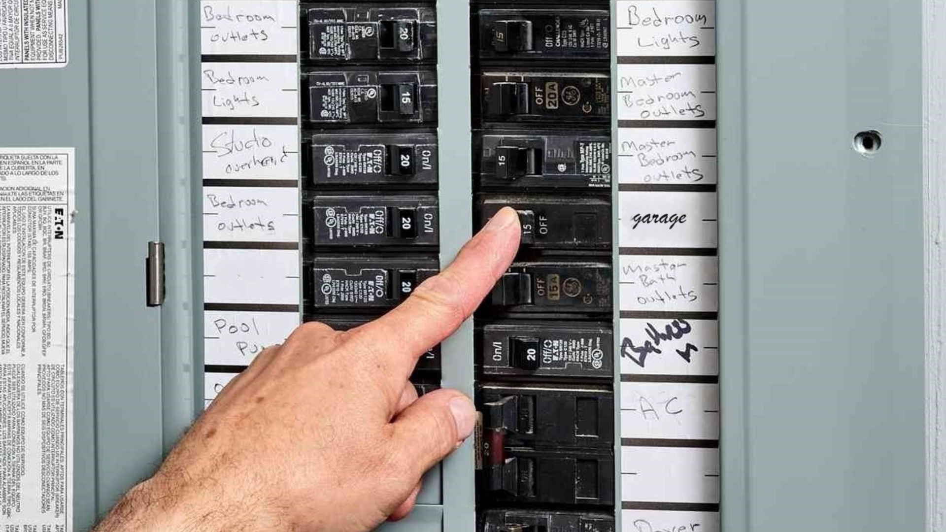 A man checking the circuit breaker