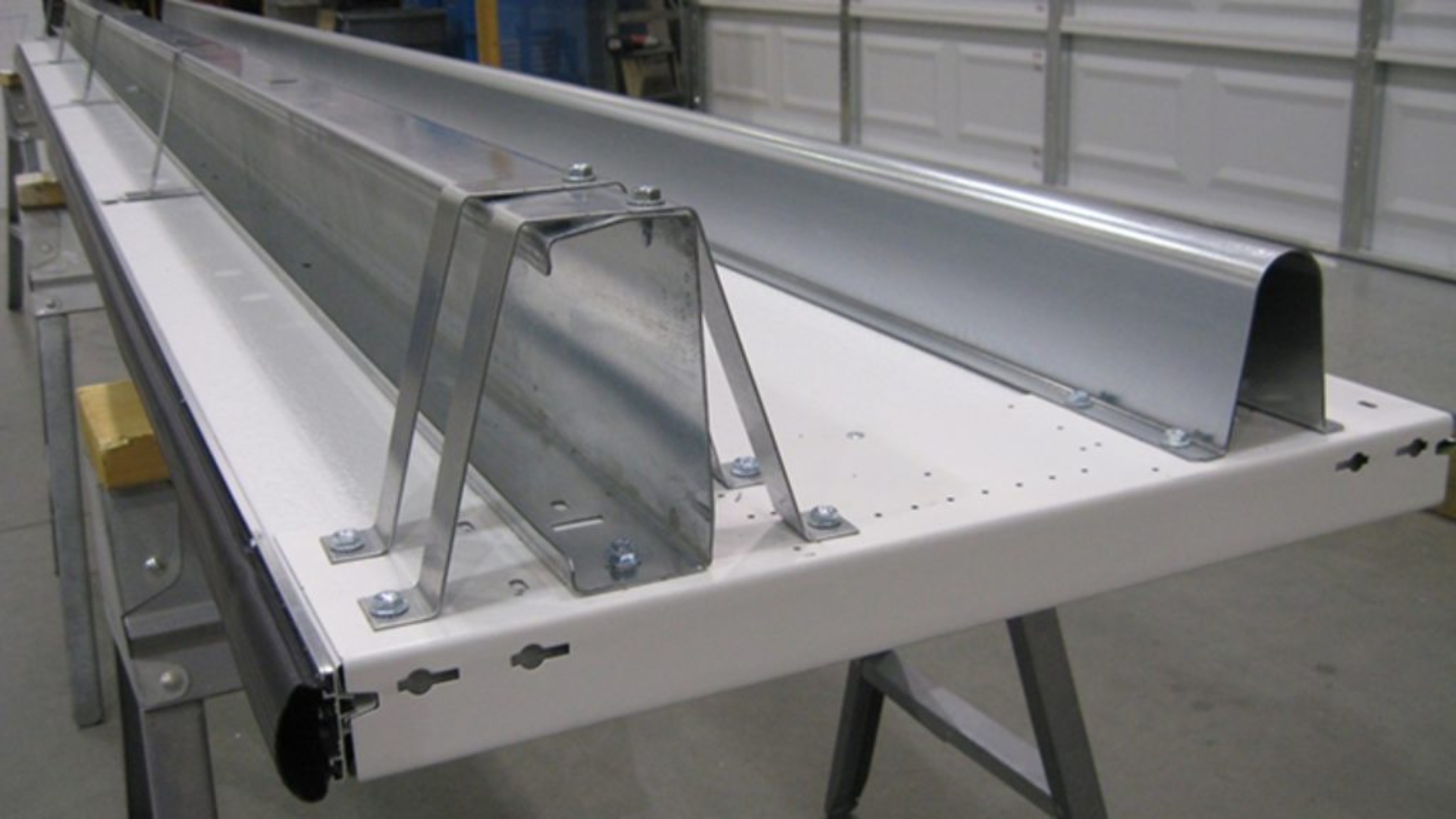 Garage door braces made of steel laid on a table