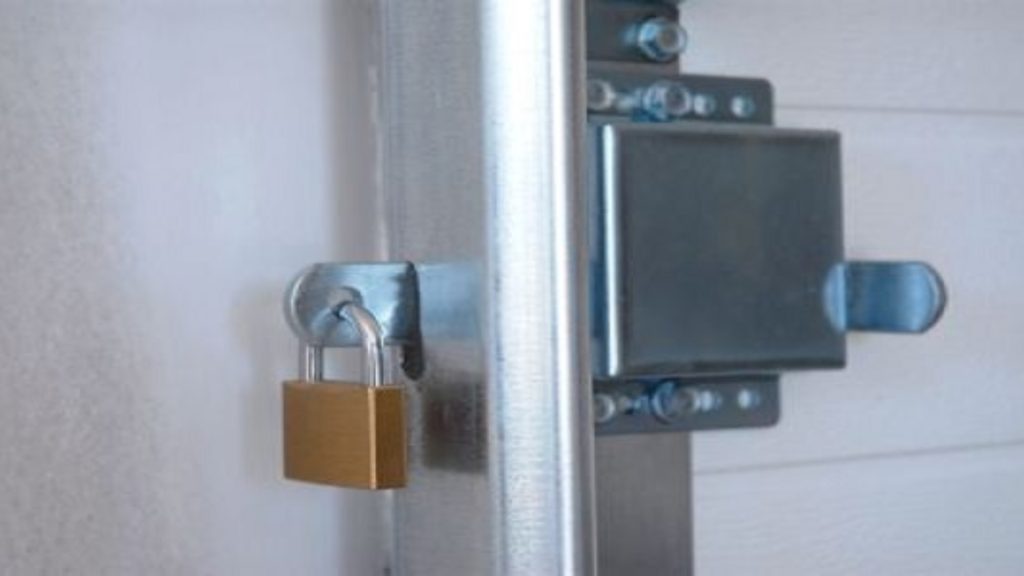 A side-bolt latch installed on the side of the garage door