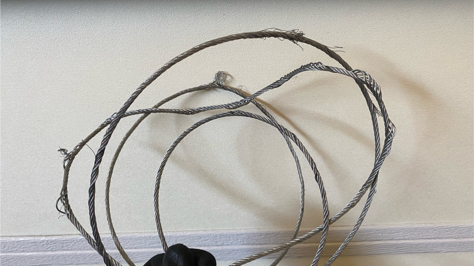 Frayed garage door cables that needs replacement