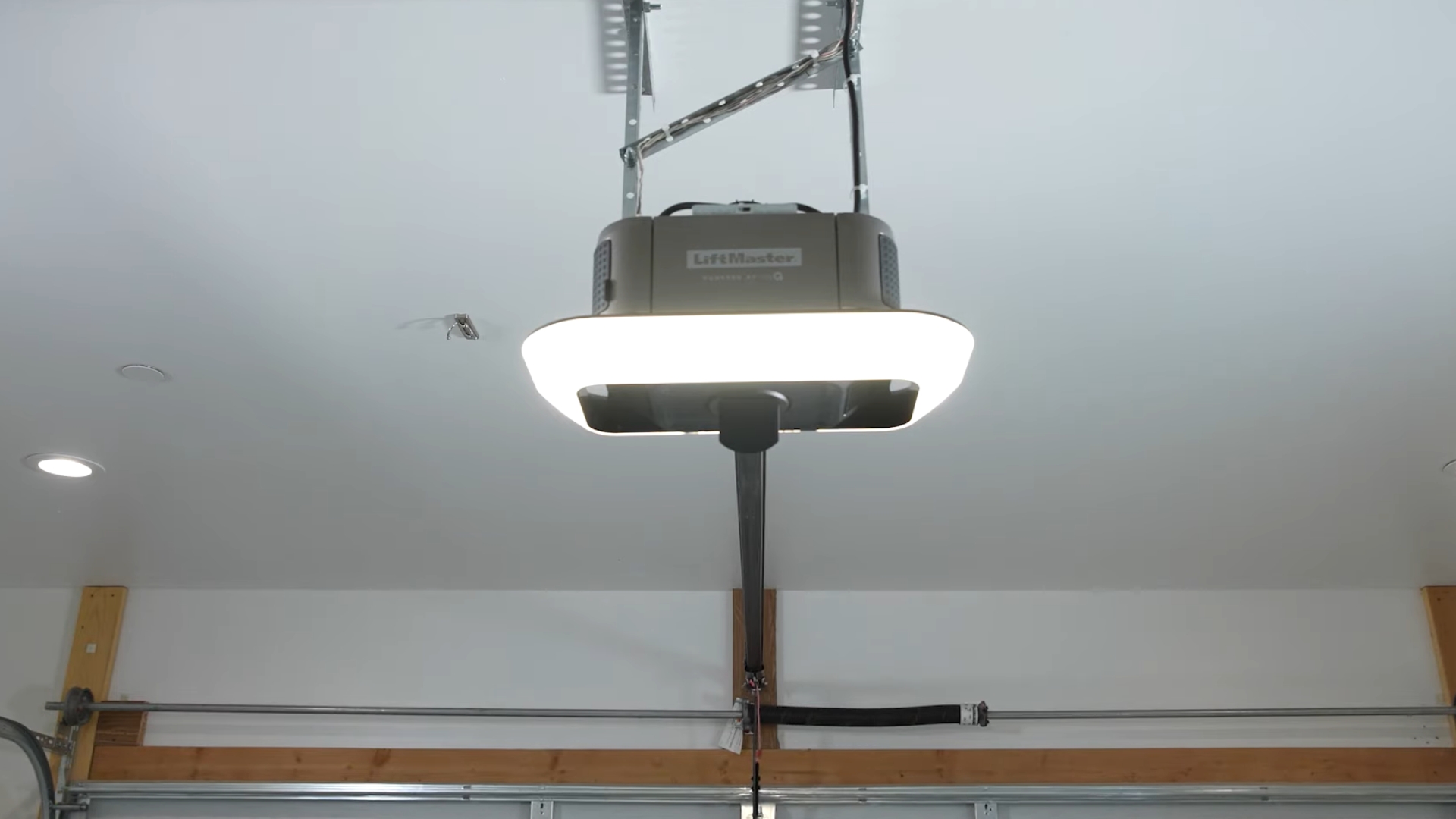 A LiftMaster belt drive garage door opener installed on the ceiling