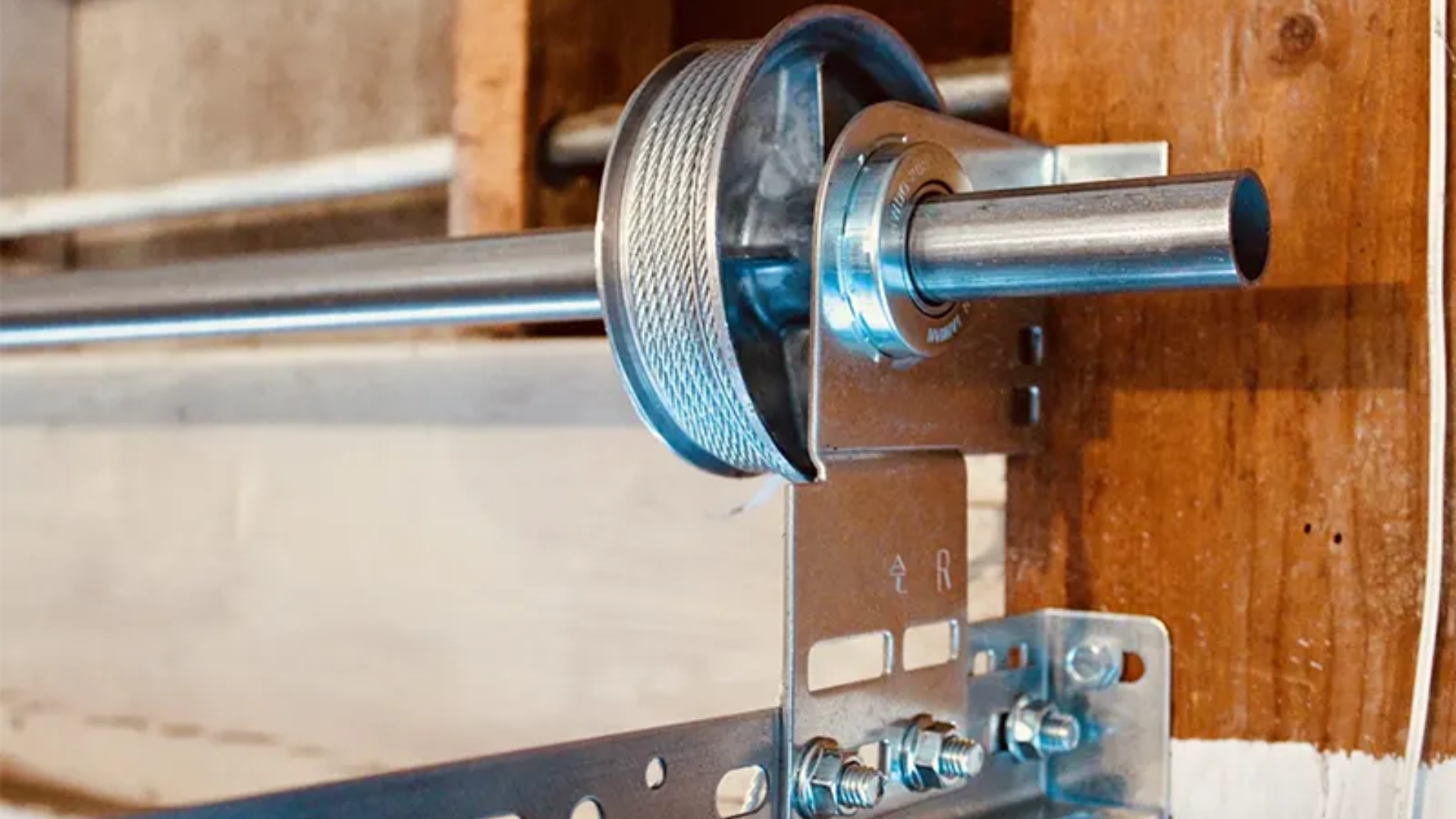 Garage door cable drum installed on a torsion bar