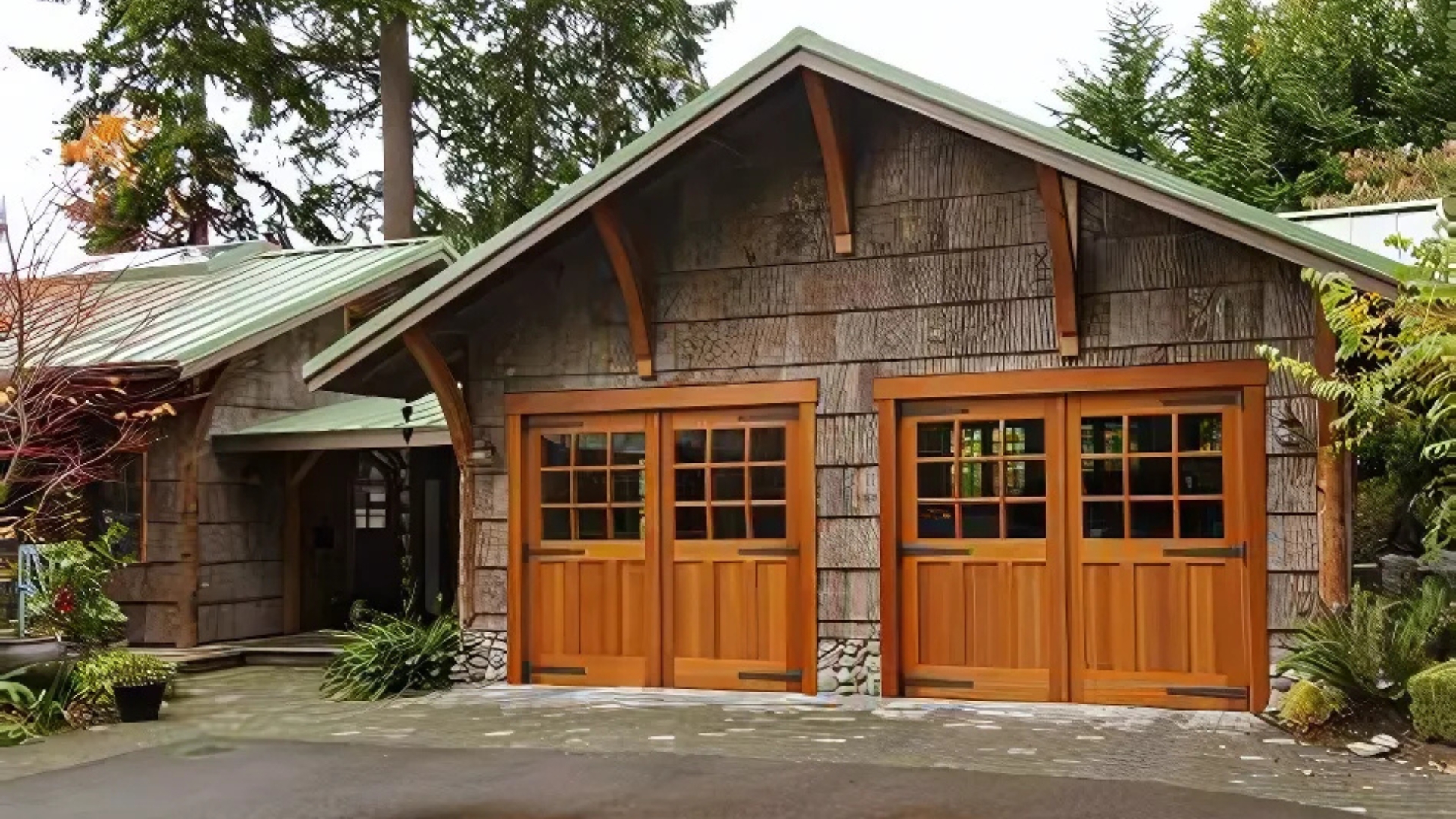 Rustic wood garage doors on a charming cabin-style home.