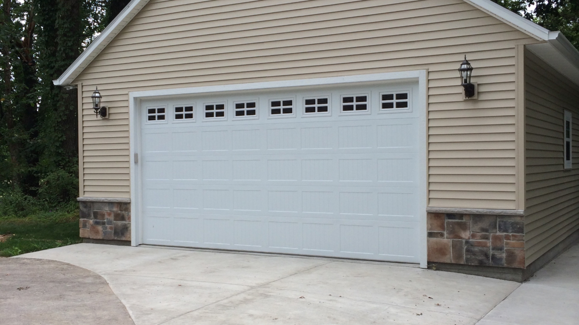 Two-car garage setup on a traditional home.