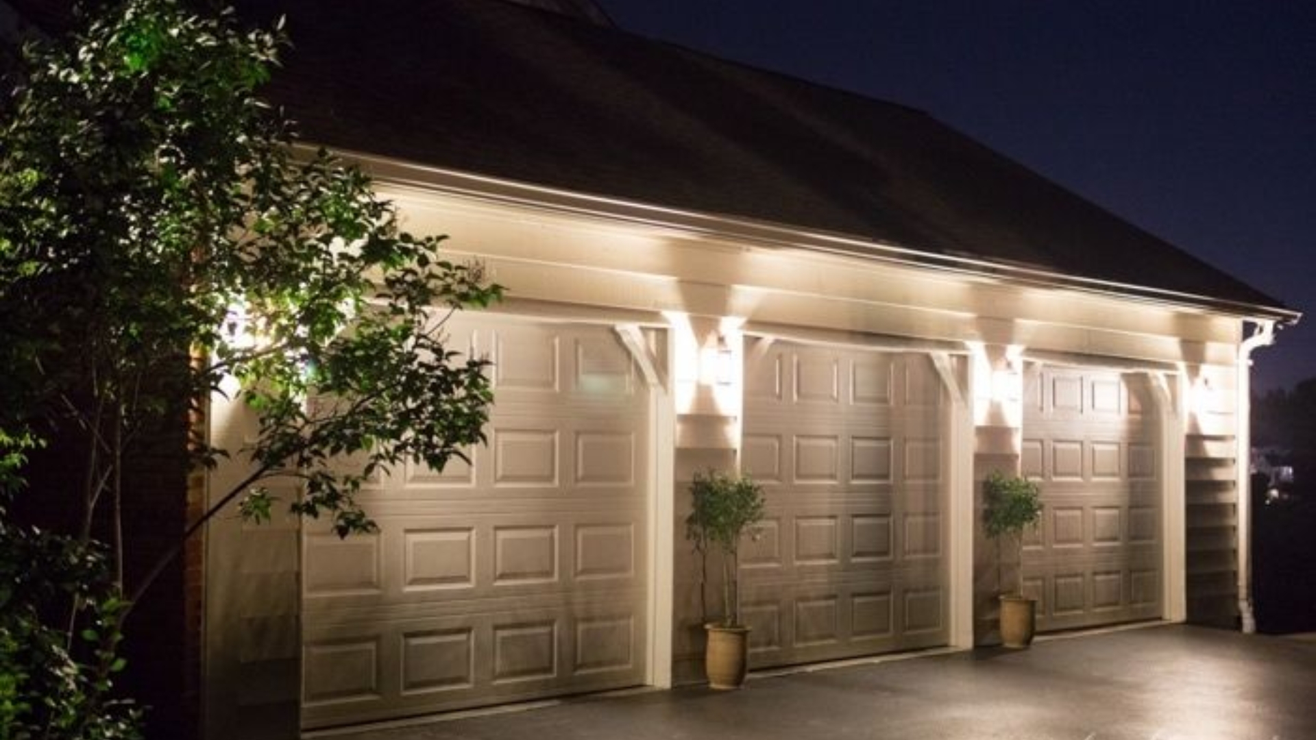 Home garage doors lit with motion-sensor or ambient lighting